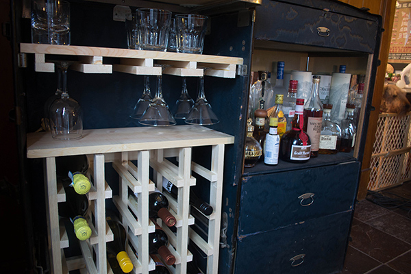 One of a kind steamer trunk made into a bar cart with some Scrap wood and  old horse yokes as legs